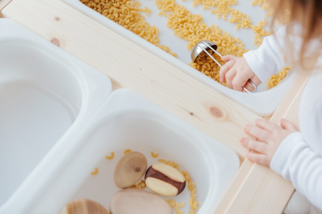sensory bin play ideas: play with raw macaroni food