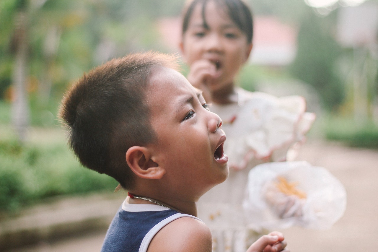 A close-up of a crying child
Description automatically generated with low confidence